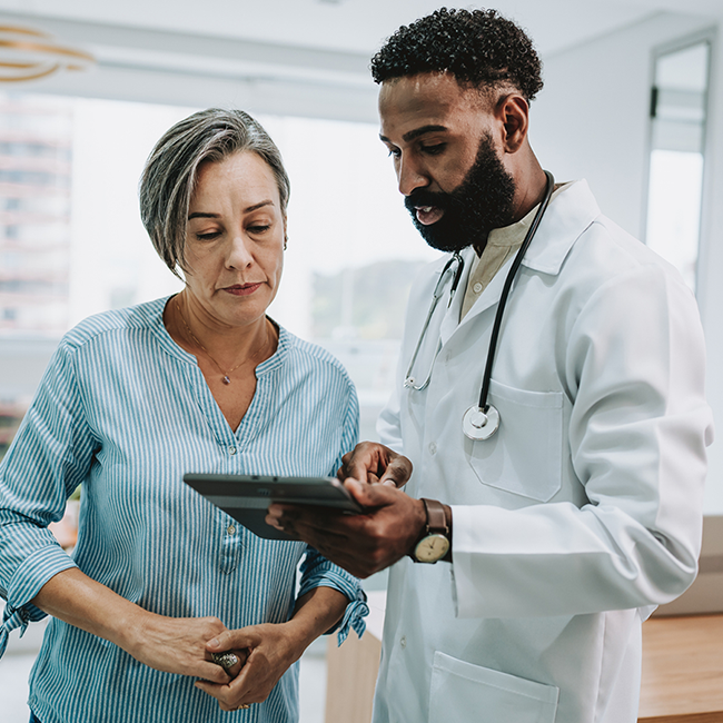 health care professionals reading information from a table